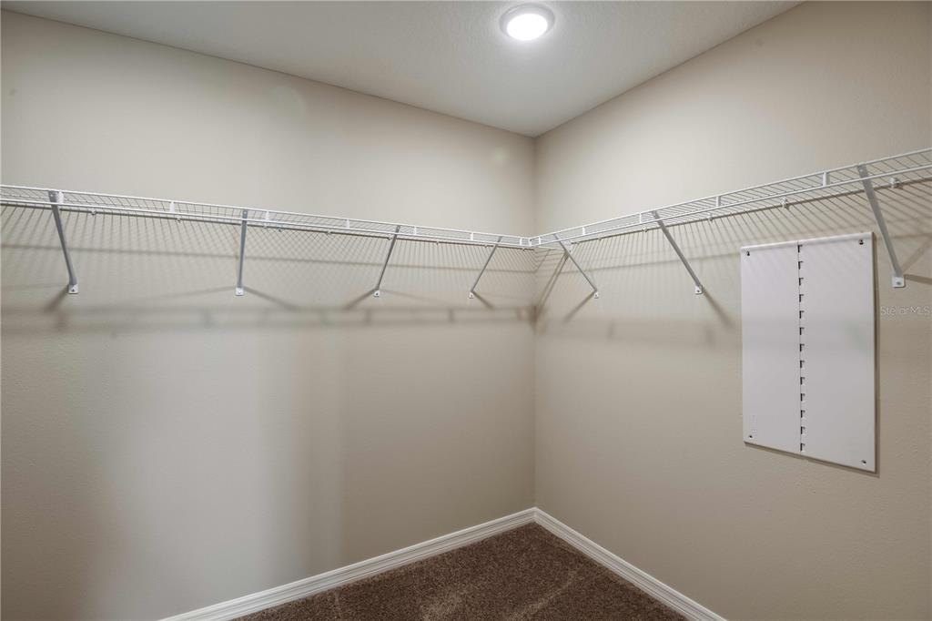 1338 Palmeroy Road Haines City, FL 33844 - Photo 22 of 32 a view of a room with racks on the wall