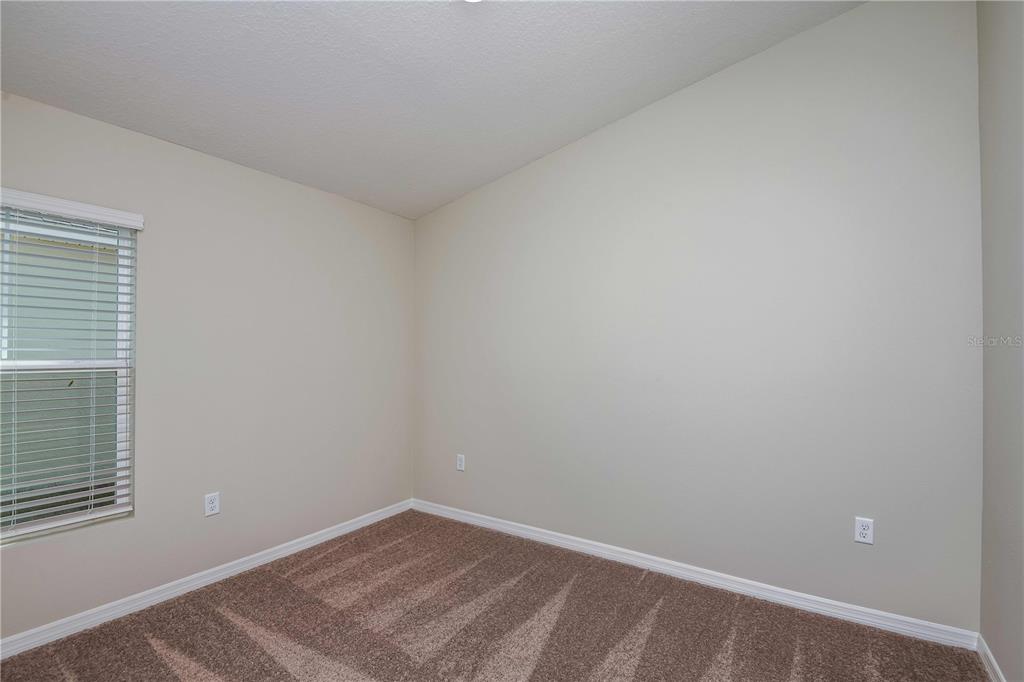 1338 Palmeroy Road Haines City, FL 33844 - Photo 23 of 32 a view of an empty room with a window
