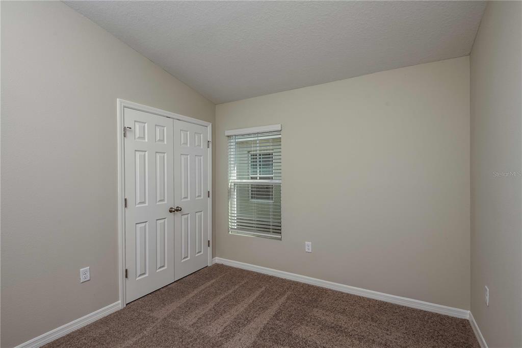 1338 Palmeroy Road Haines City, FL 33844 - Photo 24 of 32 an empty room with windows