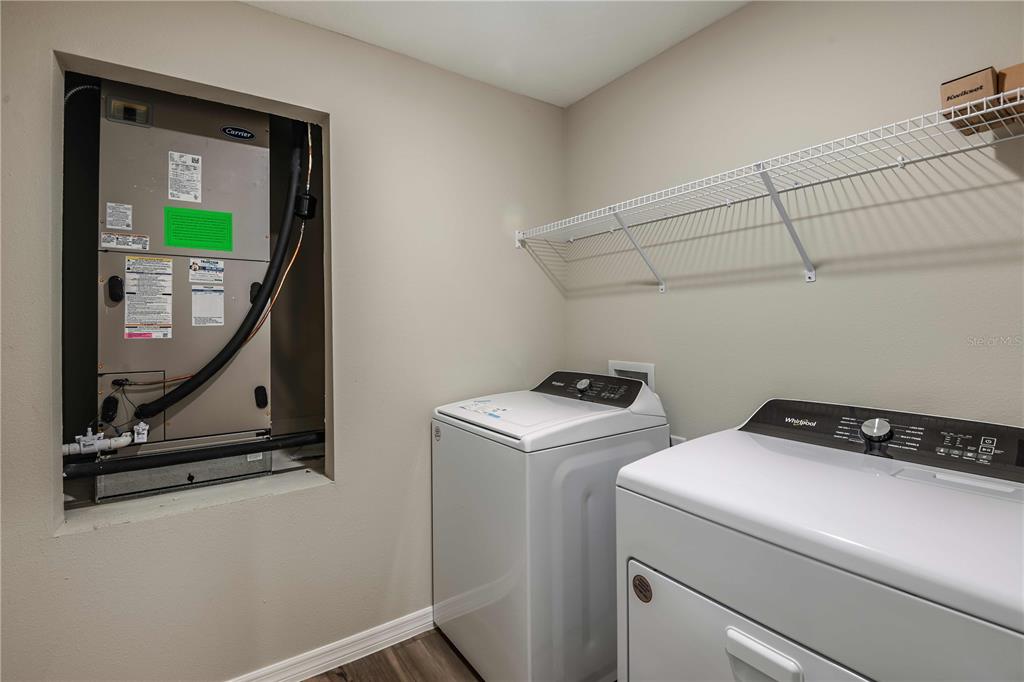 1338 Palmeroy Road Haines City, FL 33844 - Photo 30 of 32 a utility room with dryer and washer