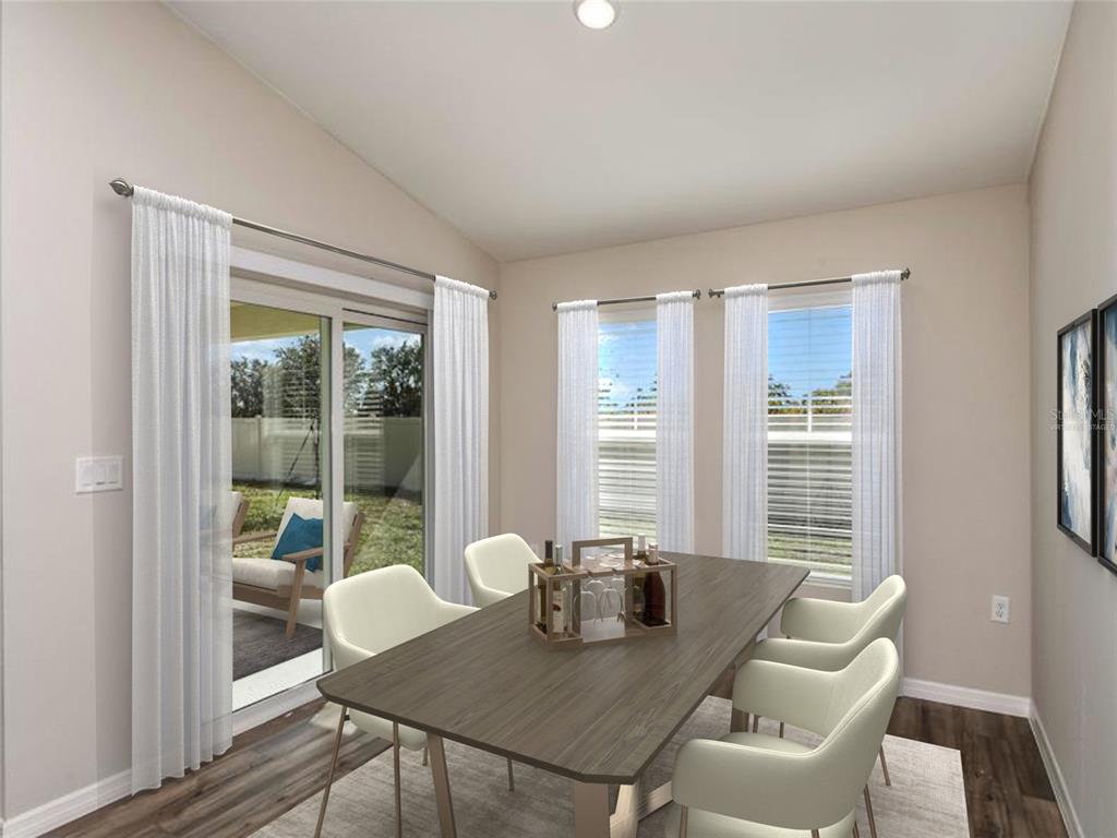 1338 Palmeroy Road Haines City, FL 33844 - Photo 3 of 32 a view of a dining room with furniture window and wooden floor