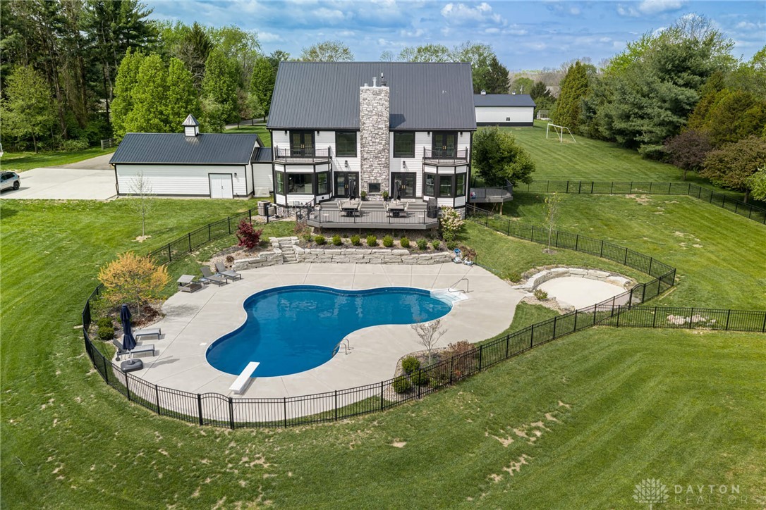 9586 Ferry Road Waynesville, OH 45068 - Photo 34 of 40 This expansive estate features a captivating backyard with a private pool and ample green space.