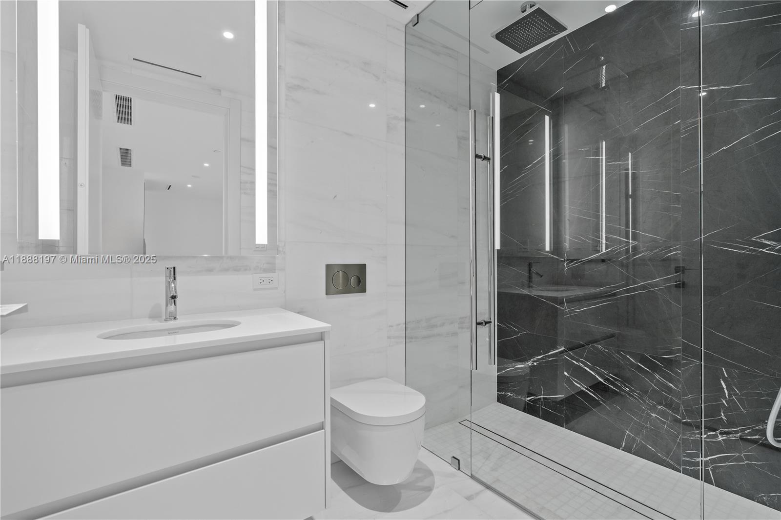 300 Biscayne Blvd Way, Unit 1103 Miami, FL 33131 - Photo 14 of 47 a bathroom with a toilet sink and shower