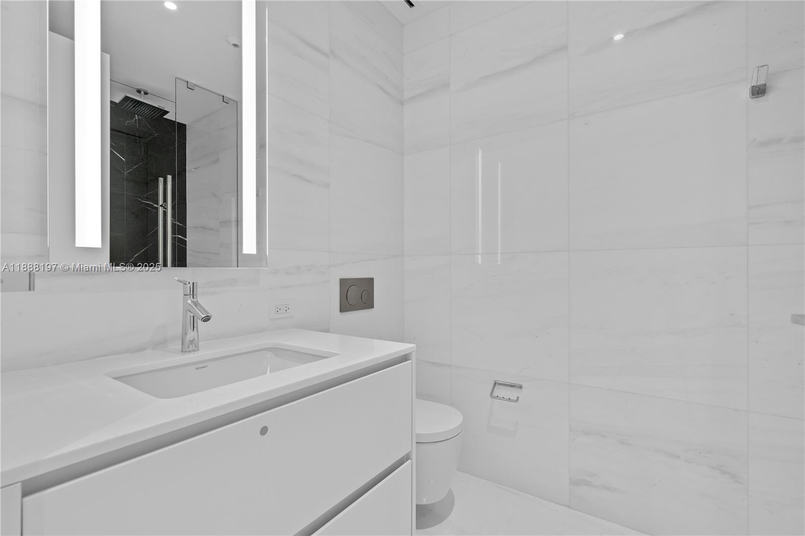 300 Biscayne Blvd Way, Unit 1103 Miami, FL 33131 - Photo 15 of 47 a bathroom with a sink toilet and mirror