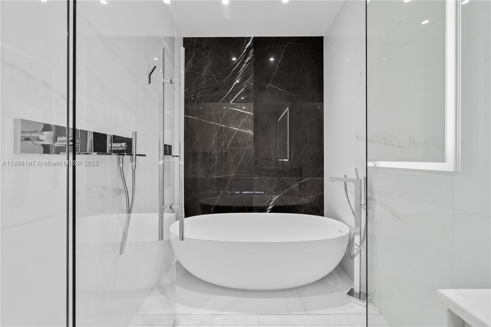 300 Biscayne Blvd Way, Unit 1103 Miami, FL 33131 - Photo 21 of 47 a bathroom with a glass shower door