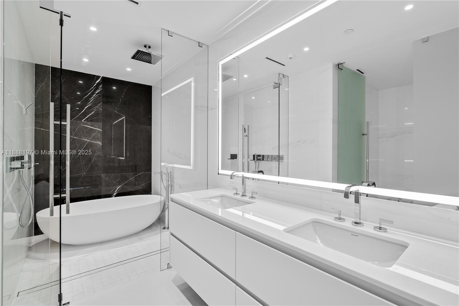 300 Biscayne Blvd Way, Unit 1103 Miami, FL 33131 - Photo 22 of 47 a bathroom with a tub sink and mirror