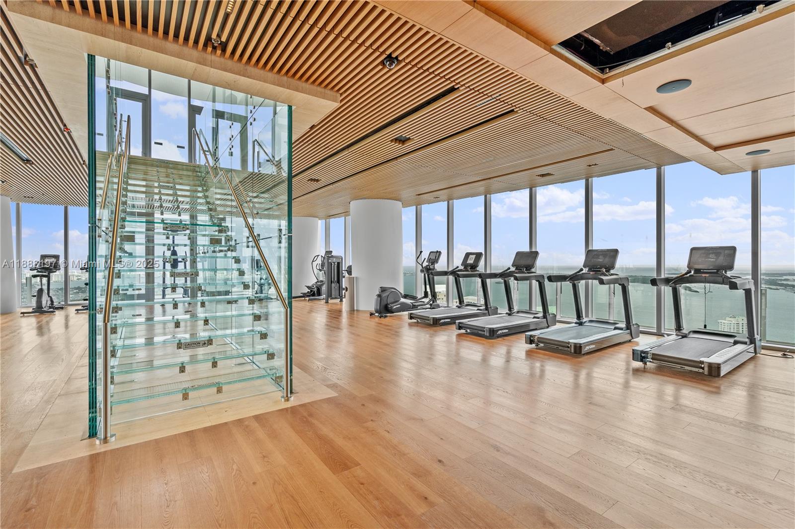 300 Biscayne Blvd Way, Unit 1103 Miami, FL 33131 - Photo 40 of 47 a view of a livingroom with hardwood floor and a ceiling fan