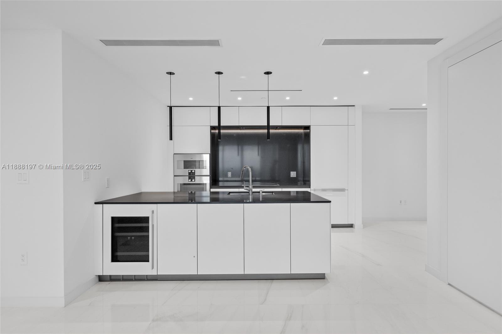 300 Biscayne Blvd Way, Unit 1103 Miami, FL 33131 - Photo 4 of 47 a kitchen with stainless steel appliances a sink and a refrigerator