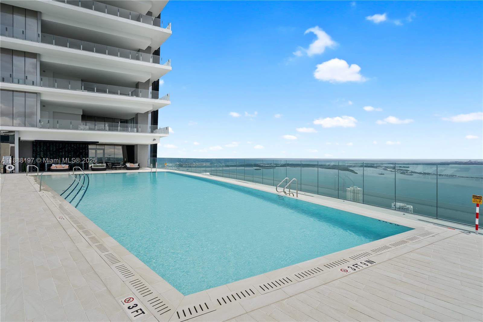 300 Biscayne Blvd Way, Unit 1103 Miami, FL 33131 - Photo 42 of 47 a view of a swimming pool and lounge chair