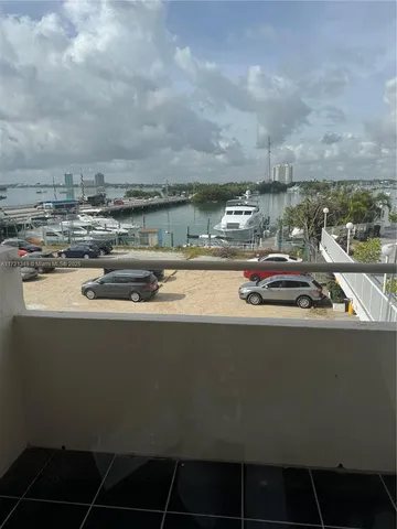 a view of a kitchen with granite countertop a sink and a stove