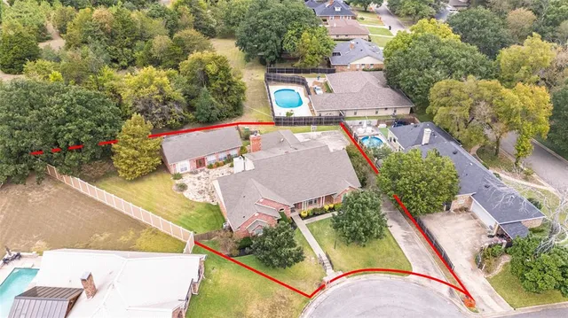 an aerial view of a house with swimming pool