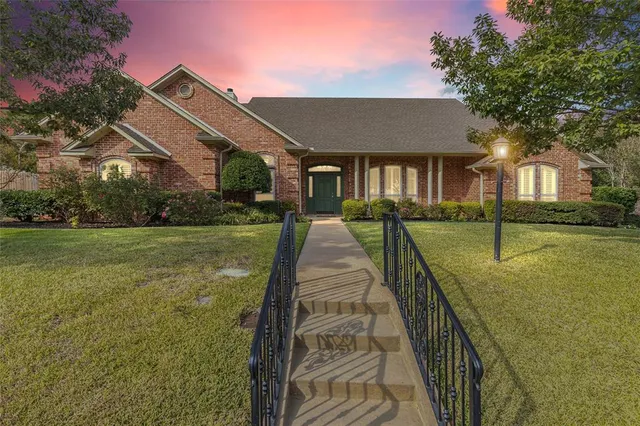 a front view of a house with yard