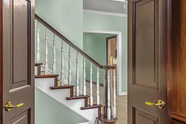 a view of staircase and living room