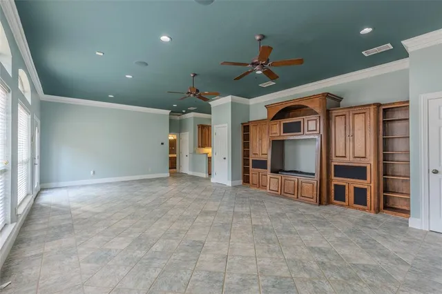 a view of a livingroom with furniture and a window