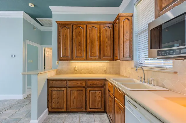a utility room with a sink washer and dryer