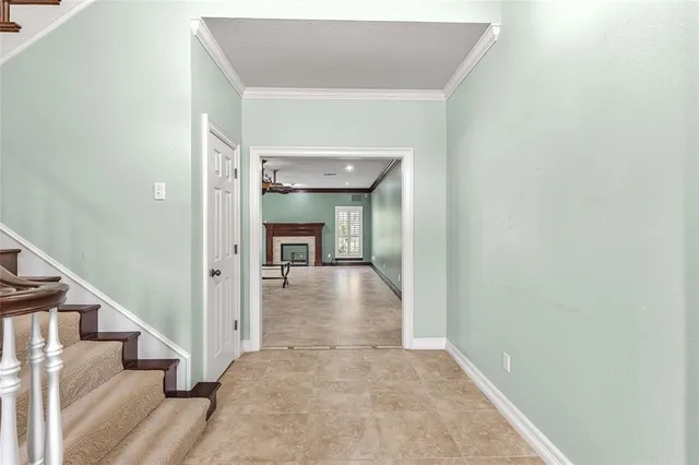 a view of a hallway view with wooden floor and staircase