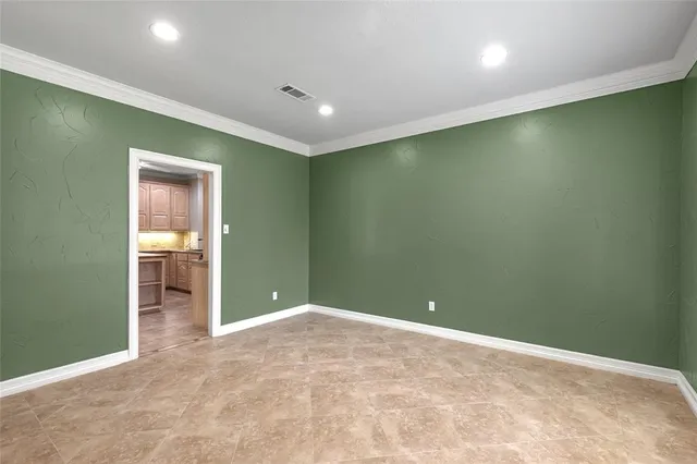 an empty room with closet and wooden floor