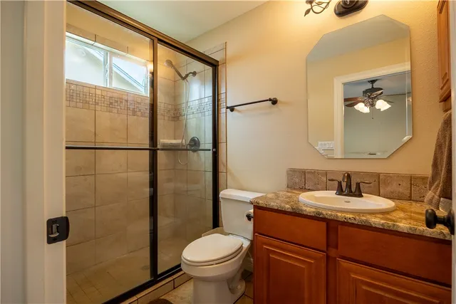 a bedroom with two beds and wooden floor