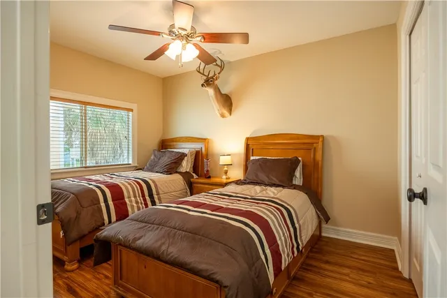 a bathroom with a sink a toilet and shower curtain