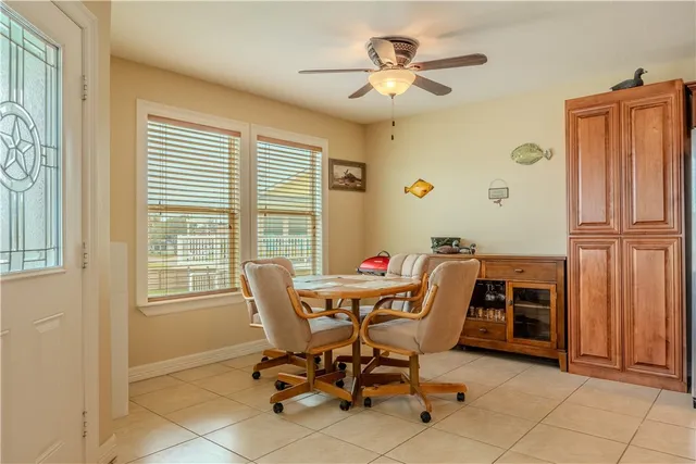 a dining room with furniture and window