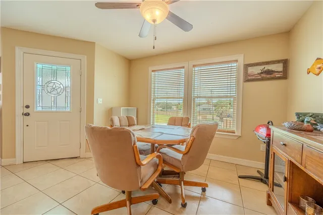 a living room with a couch and a chandelier