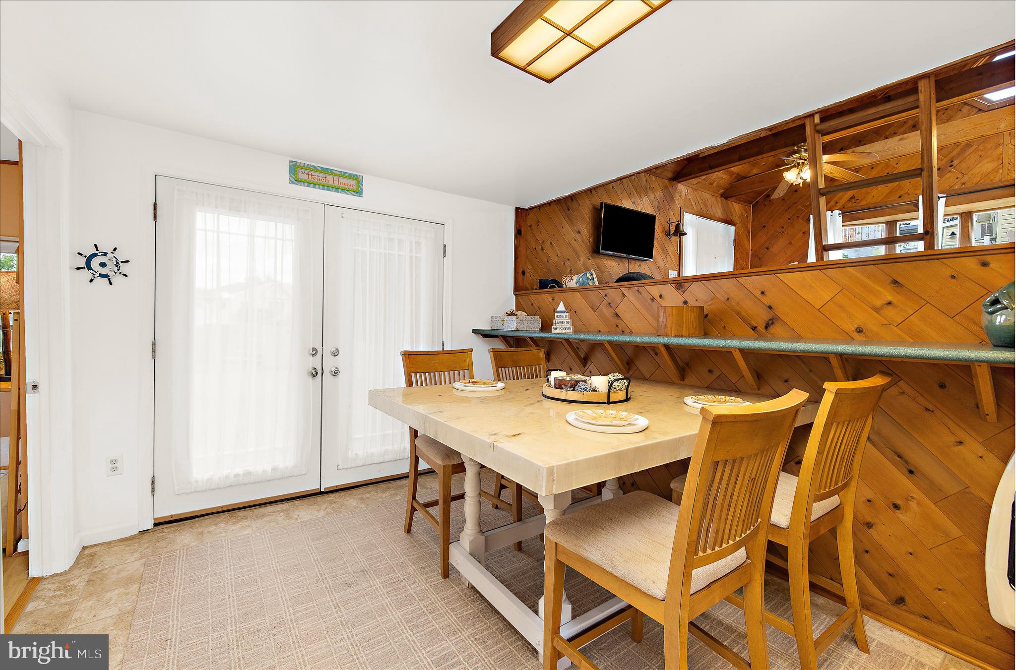 25 Locust Street Earleville, MD 21919 - Photo 19 of 64 a view of a dining room with furniture and a window
