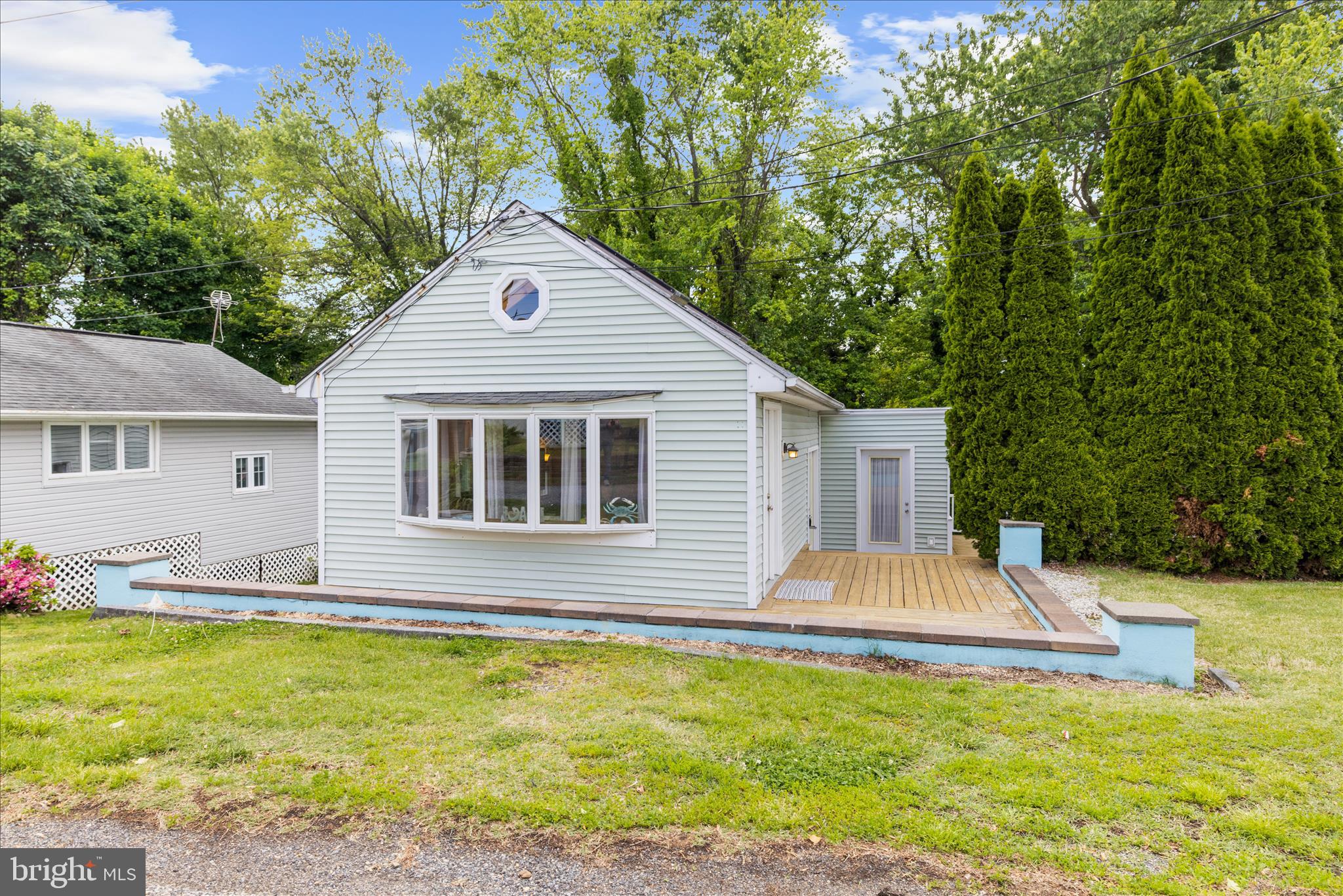 25 Locust Street Earleville, MD 21919 - Photo 6 of 64 a front view of house with yard and trees in the background