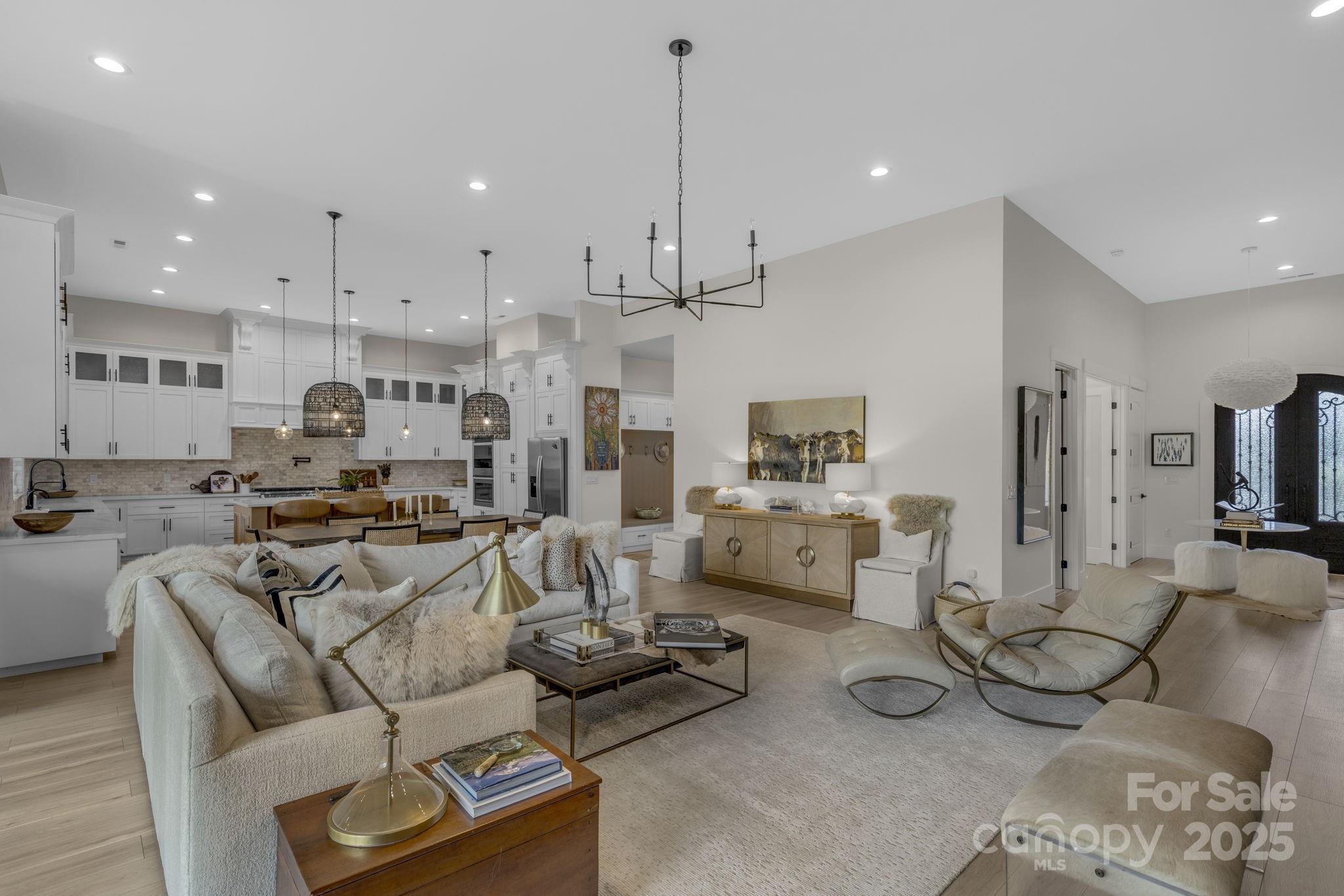 416 World Tour Drive Inman, SC 29349 - Photo 12 of 45 a living room with furniture kitchen view and a chandelier