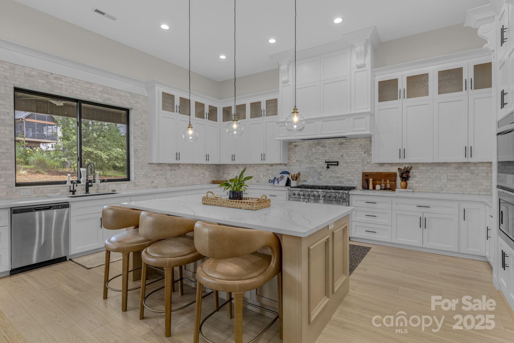 416 World Tour Drive Inman, SC 29349 - Photo 14 of 45 a kitchen with a sink cabinets and wooden floor