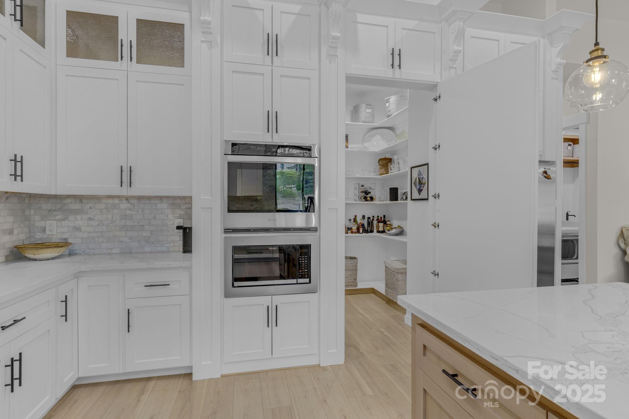 416 World Tour Drive Inman, SC 29349 - Photo 17 of 45 a kitchen with stainless steel appliances granite countertop white cabinets and window