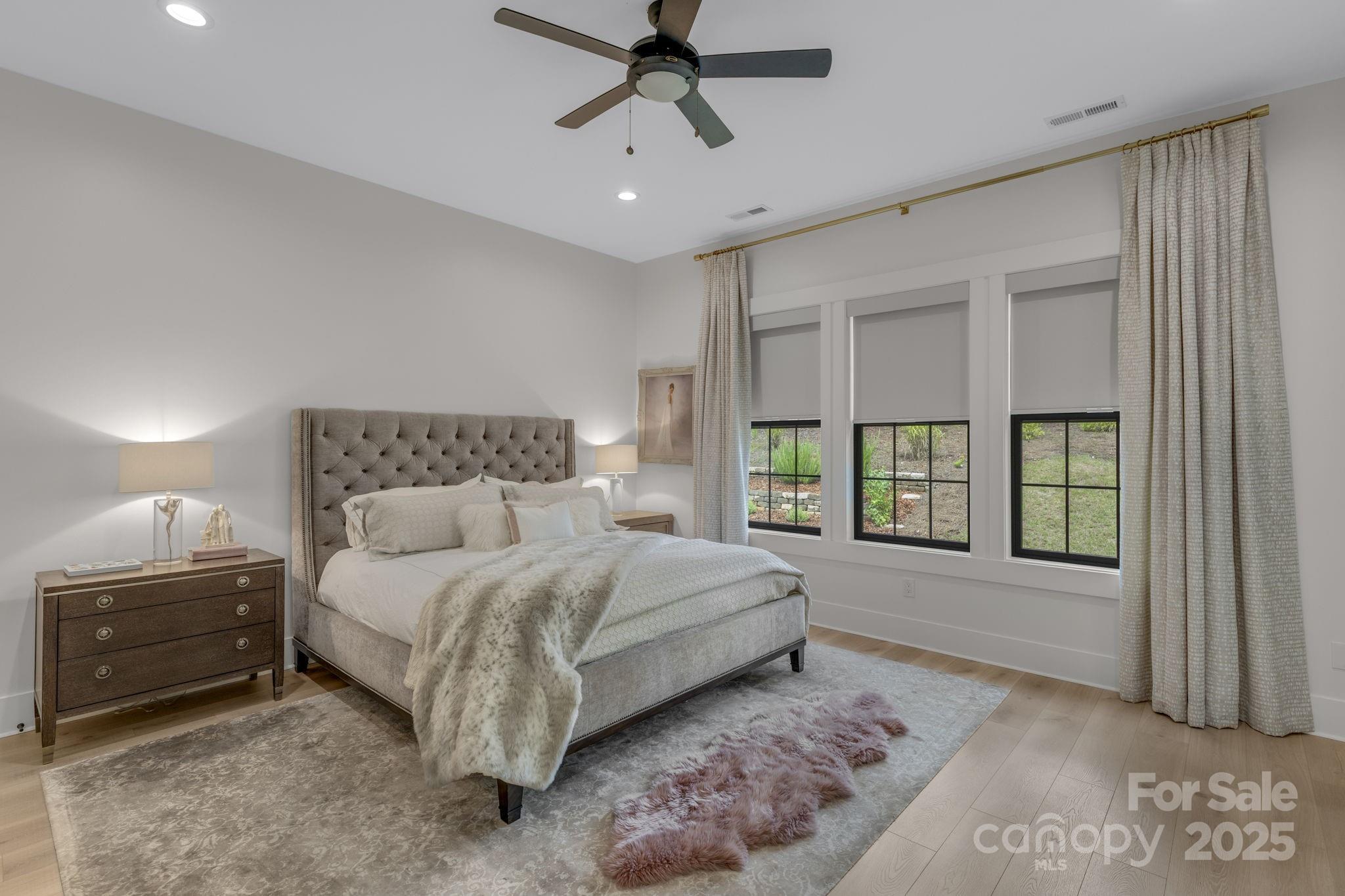 416 World Tour Drive Inman, SC 29349 - Photo 19 of 45 a spacious bedroom with a bed and a large window