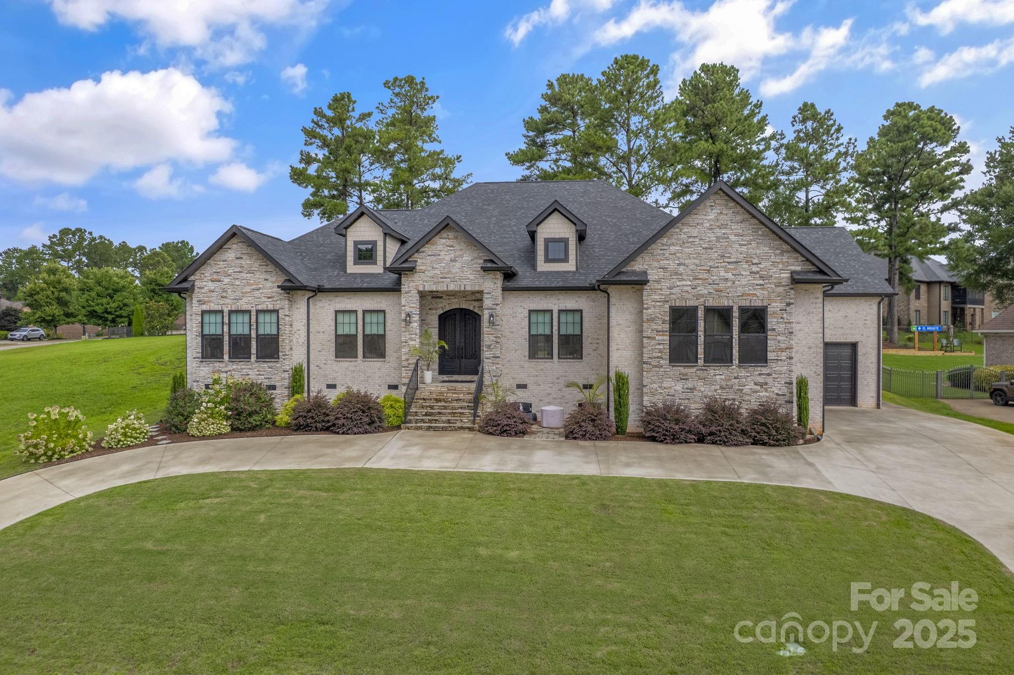 416 World Tour Drive Inman, SC 29349 - Photo 3 of 45 a front view of a house with a garden and yard