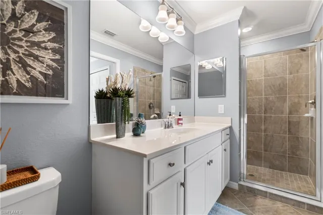 a bathroom with a sink a mirror and a shower