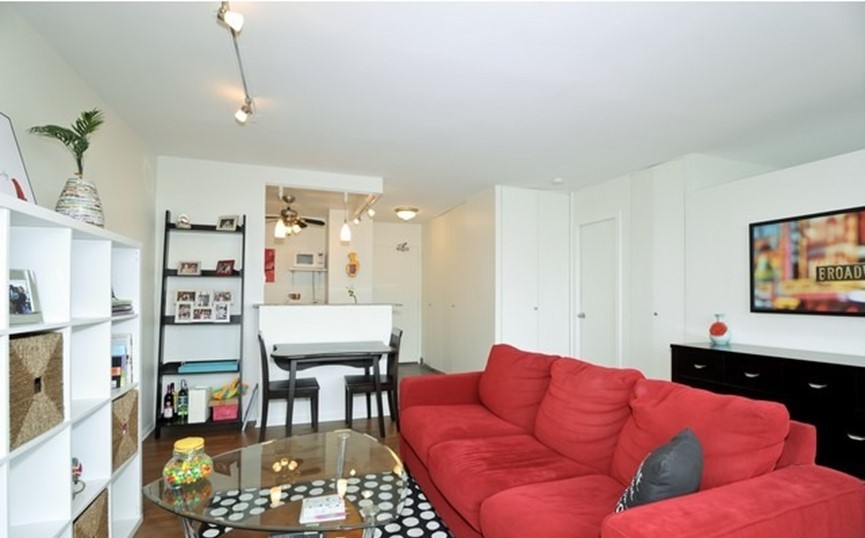 Undisclosed Address Chicago, IL 60610 - Photo 4 of 8 a living room with furniture and a flat screen tv