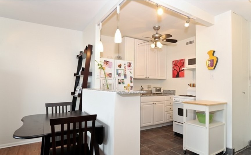Undisclosed Address Chicago, IL 60610 - Photo 5 of 8 a kitchen with appliances cabinets and furniture