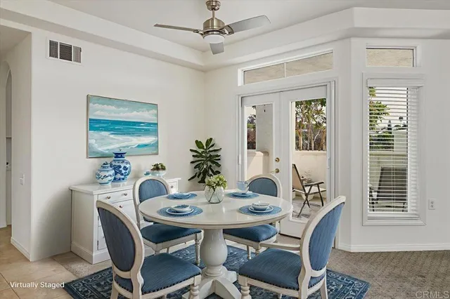 a view of a dining room with furniture and window