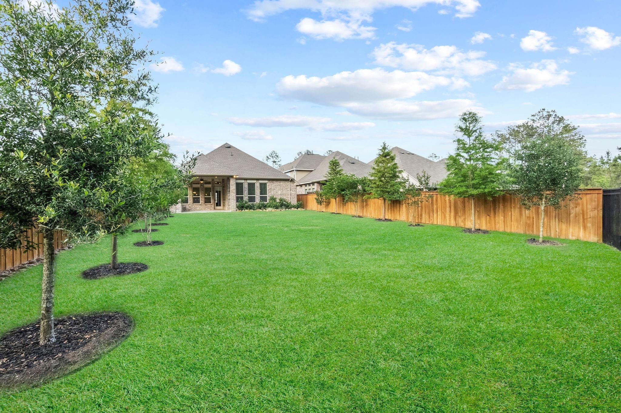 4326 Victoria Pine Drive Spring, TX 77386 - Photo 2 of 36 a view of a house with a yard and a garden