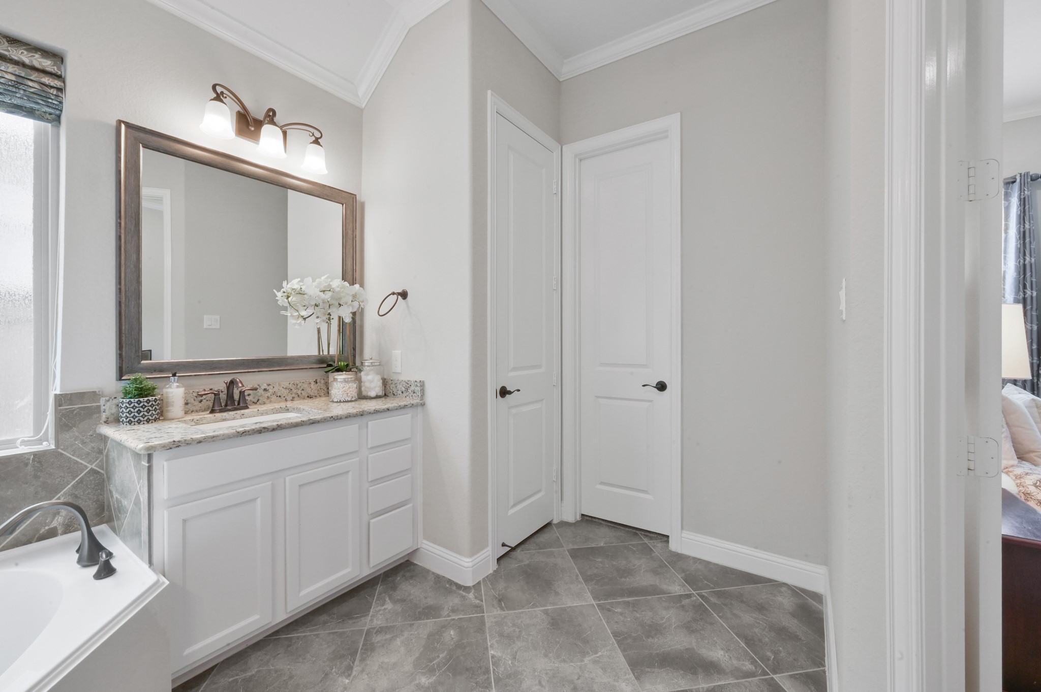 4326 Victoria Pine Drive Spring, TX 77386 - Photo 18 of 36 a bathroom with a granite countertop sink and a mirror