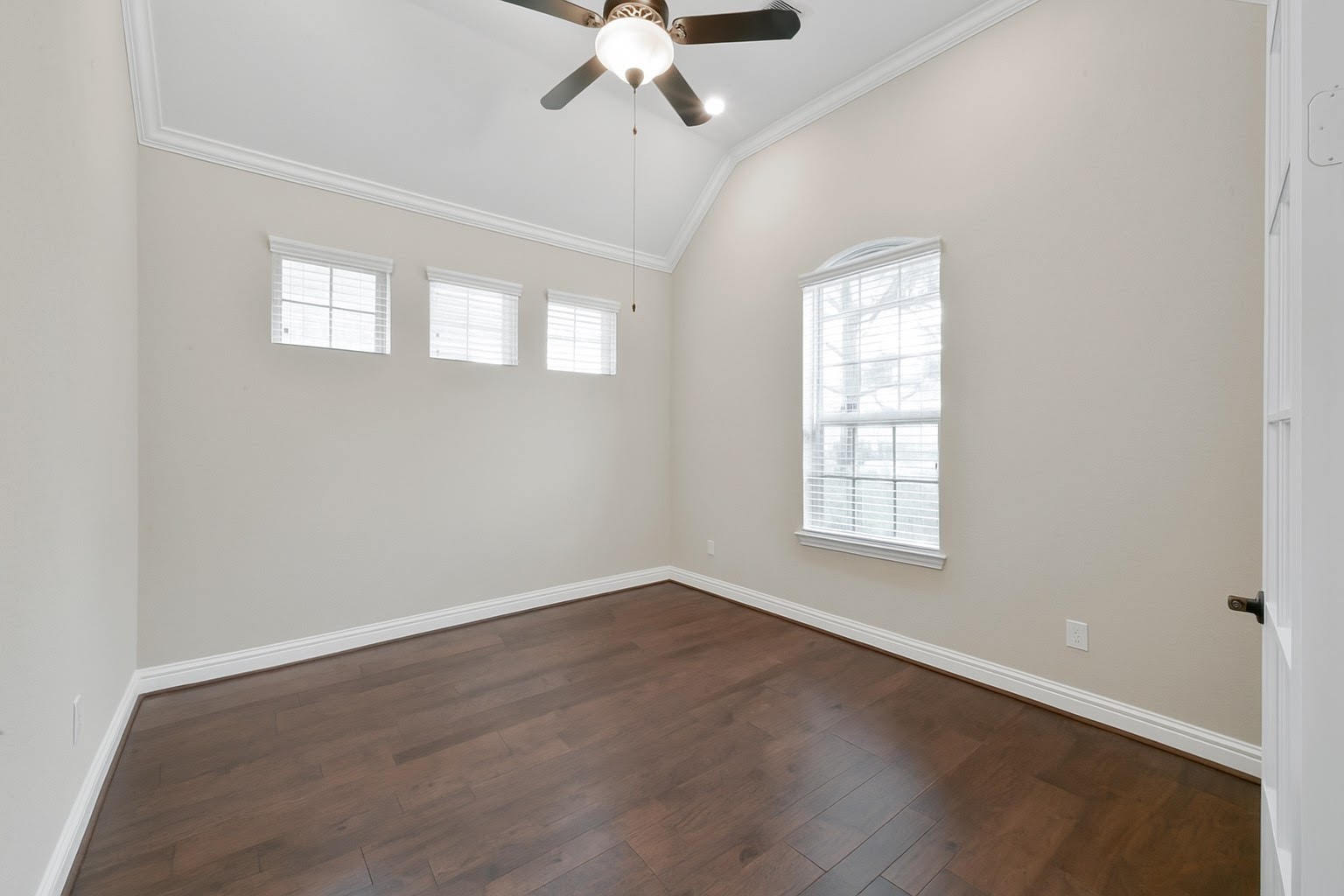 4326 Victoria Pine Drive Spring, TX 77386 - Photo 5 of 36 an empty room with wooden floor fan and windows