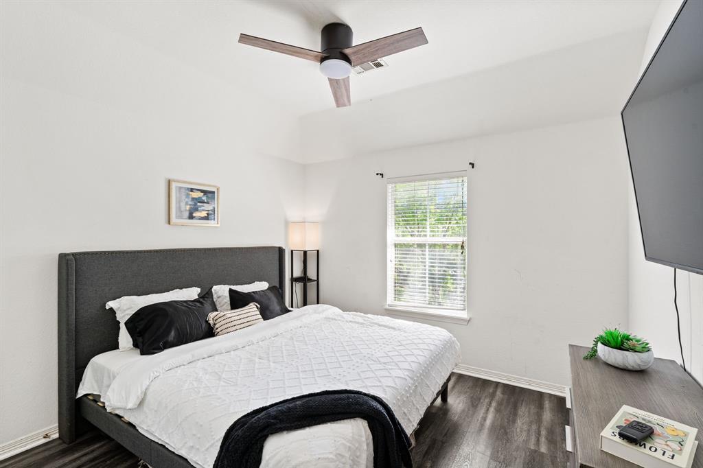 3905 Lakeside Drive Rowlett, TX 75088 - Photo 33 of 39 Bedroom with dark wood-type flooring and a ceiling fan