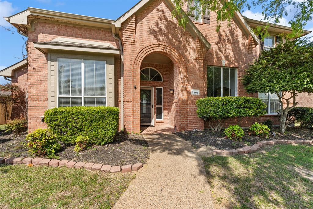 3905 Lakeside Drive Rowlett, TX 75088 - Photo 6 of 39 View of front facade with brick siding and a front yard