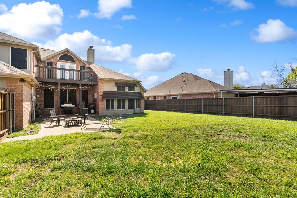 3905 Lakeside Drive Rowlett, TX 75088 - Photo 7 of 39 Fenced backyard with a patio area and a fire pit