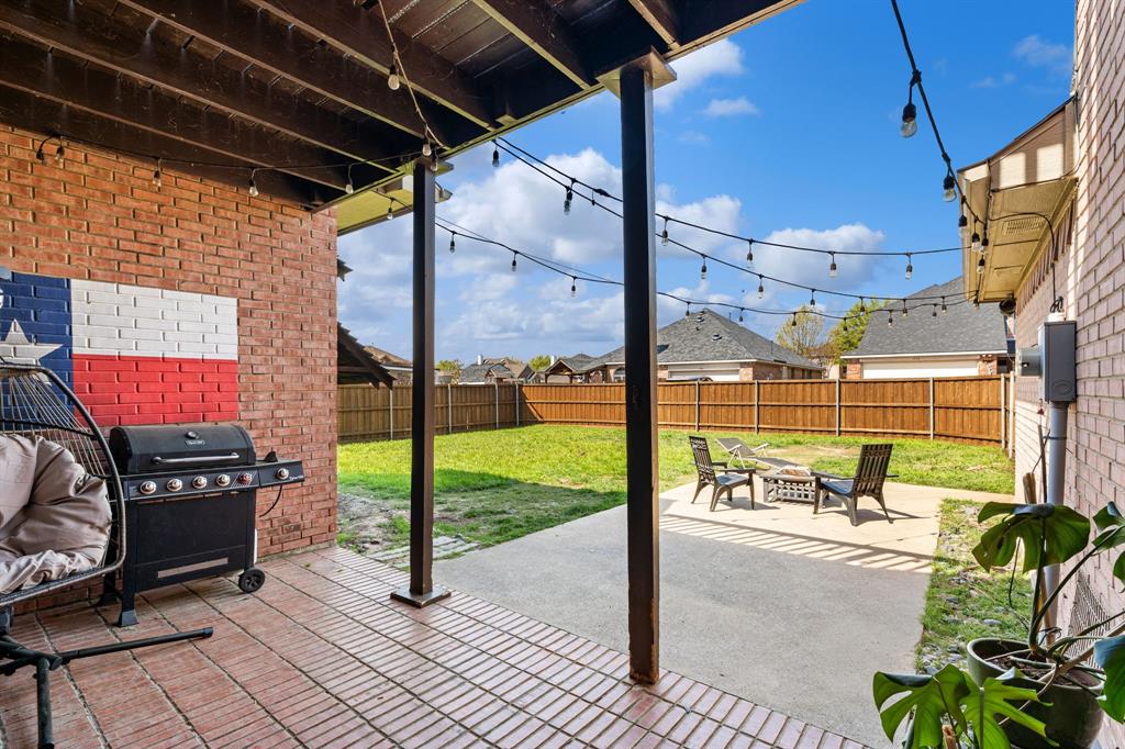 3905 Lakeside Drive Rowlett, TX 75088 - Photo 9 of 39 Fenced backyard featuring a patio, a fire pit, and a grill