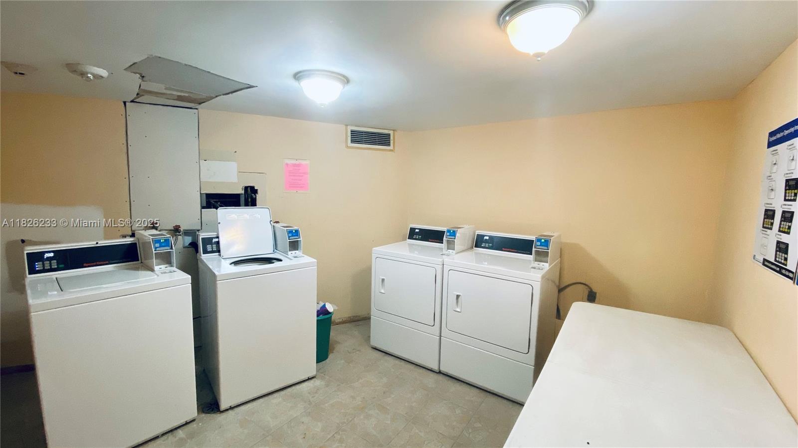 2025 Northeast 164th Street, Unit 901 North Miami Beach, FL 33162 - Photo 10 of 12 a utility room with dryer and washer