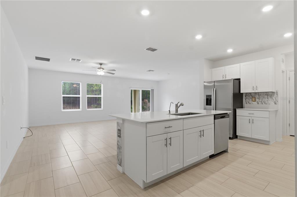 2455 Lanier Road Zephyrhills, FL 33541 - Photo 11 of 39 a kitchen with a sink and cabinets