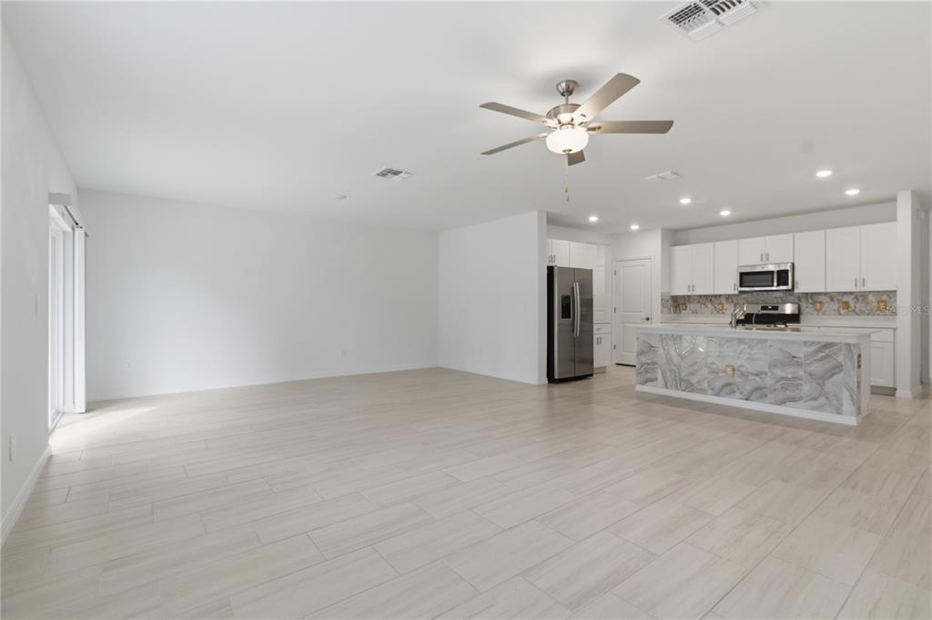 2455 Lanier Road Zephyrhills, FL 33541 - Photo 14 of 39 a view of an empty room with kitchen