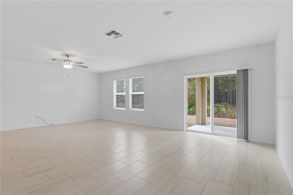 2455 Lanier Road Zephyrhills, FL 33541 - Photo 15 of 39 a view of an empty room with a window