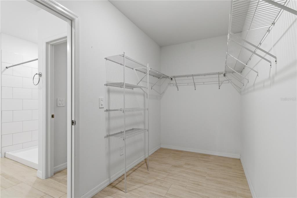 2455 Lanier Road Zephyrhills, FL 33541 - Photo 21 of 39 a view of a room with racks on the wall