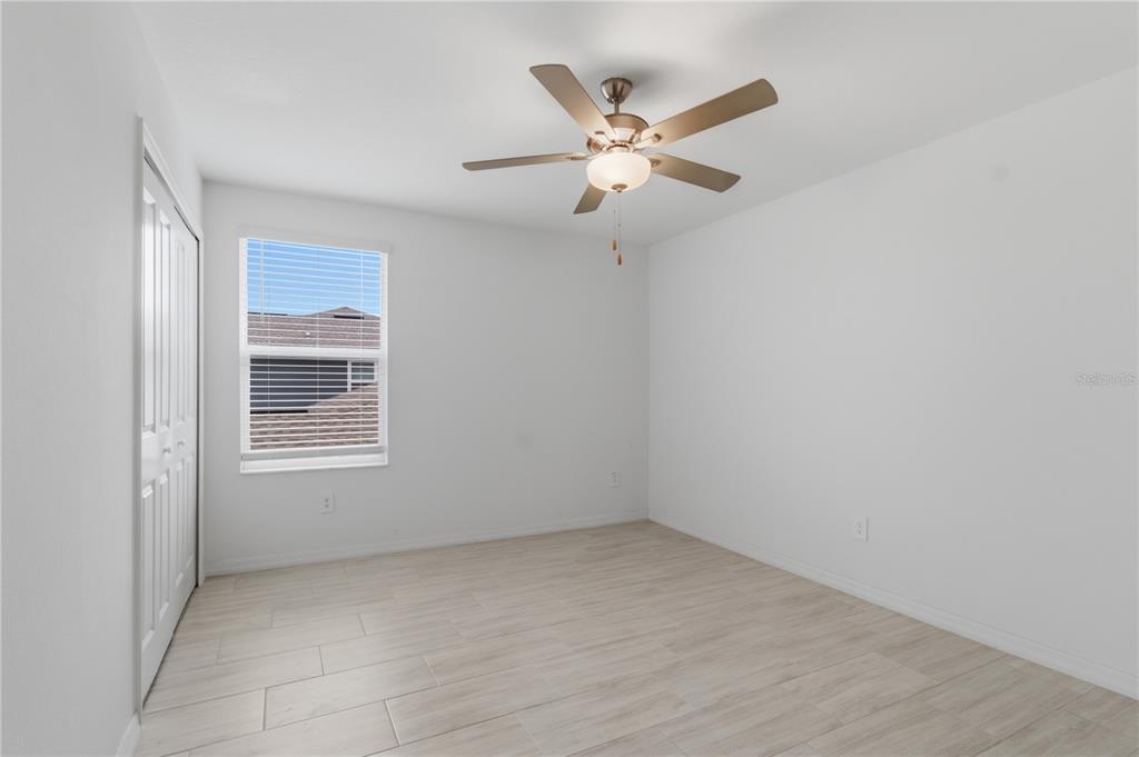 2455 Lanier Road Zephyrhills, FL 33541 - Photo 26 of 39 a view of an empty room with a window