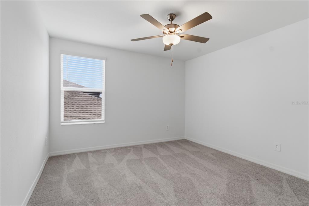 2455 Lanier Road Zephyrhills, FL 33541 - Photo 30 of 39 an empty room with a window